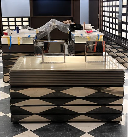 Illuminated retail display table on a checkered floor