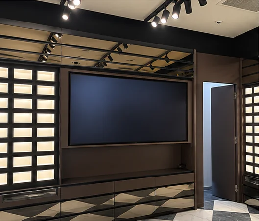 Retail media wall with a wall-mounted screen between backlit display walls
